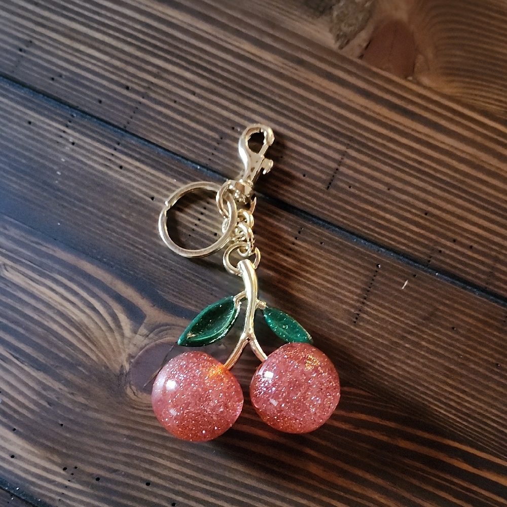 Cherry Keychain with Gold and Green Accents